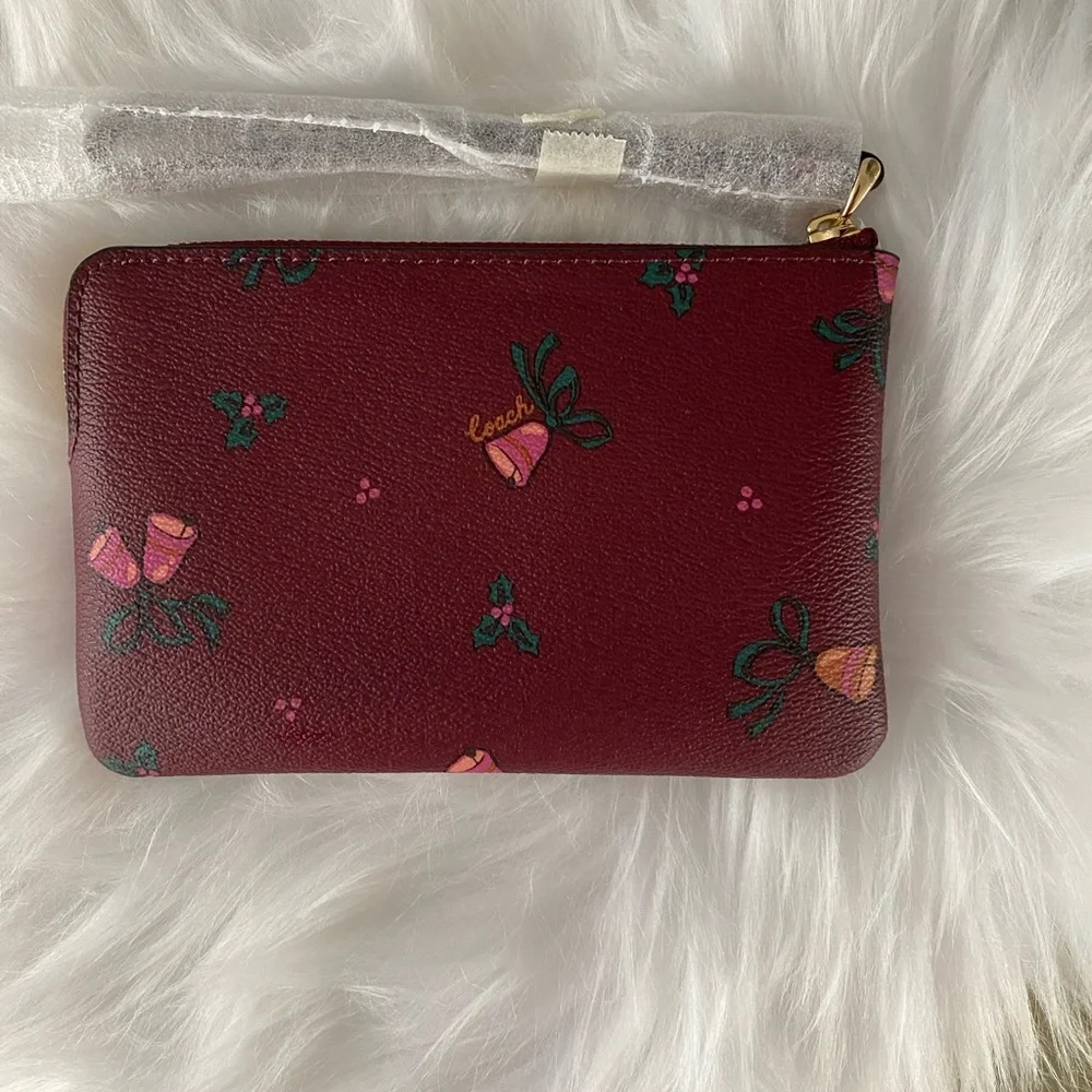 Coach NWT corner zip wristlet with holiday bells print